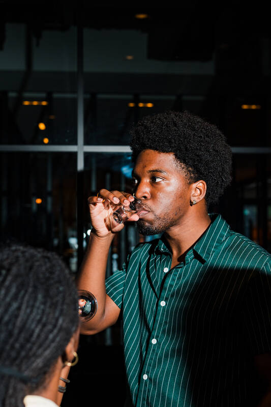 A guest nosing a pour