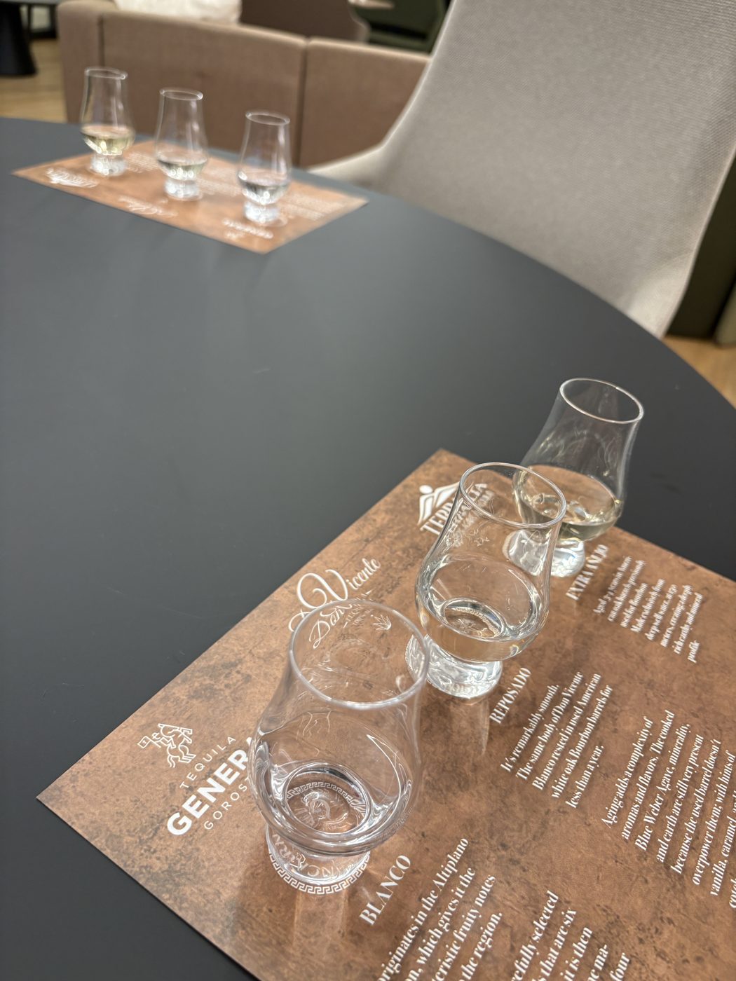 Two tasting flights poured and waiting on the table