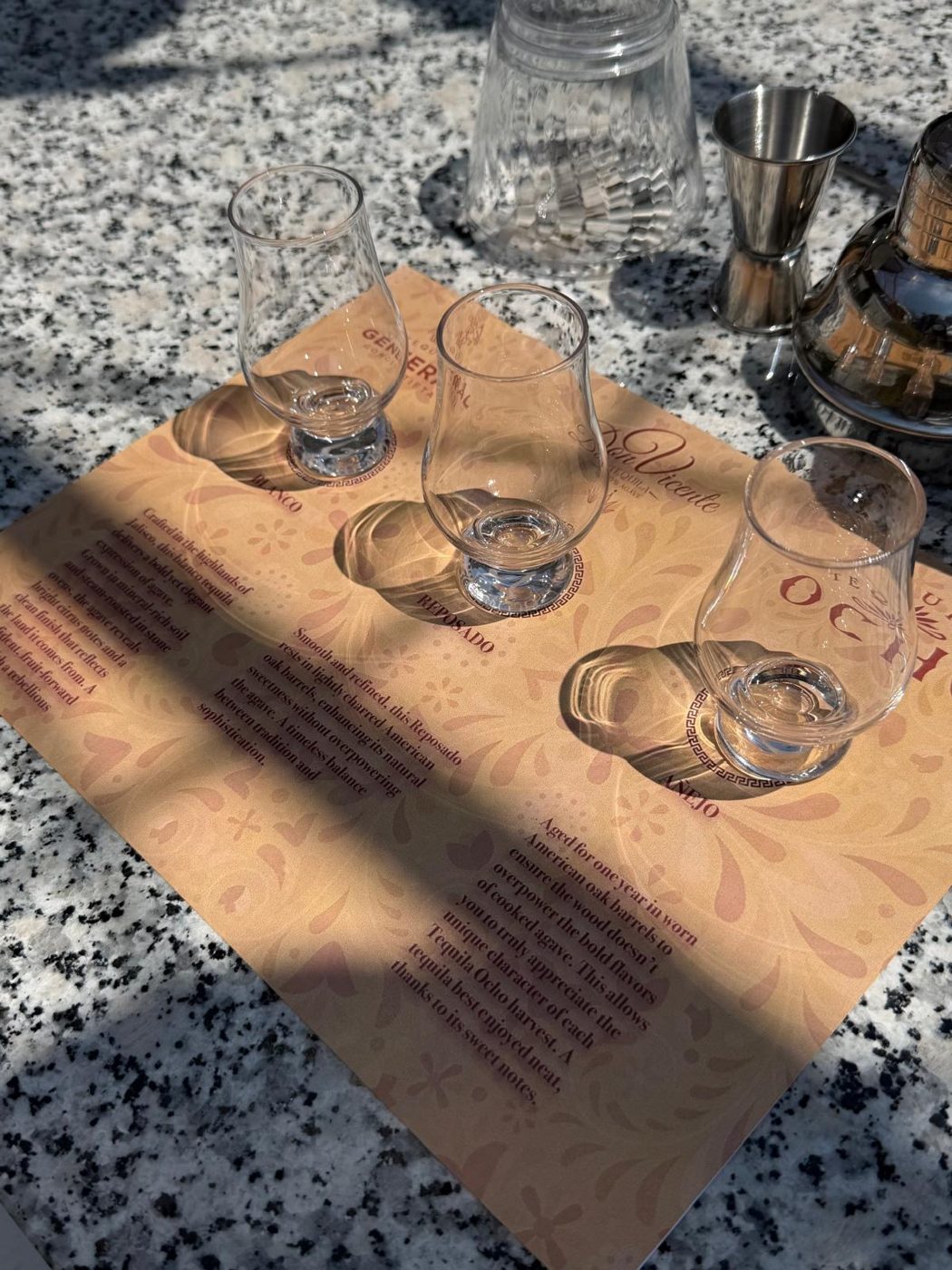 A blanco, reposado and añejo flight in afternoon light